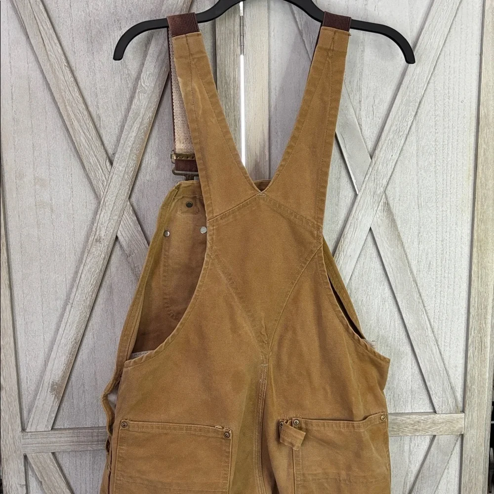 Thrashed vintage 80s or 90s carhartt unlined beige double knee duck overall bibs